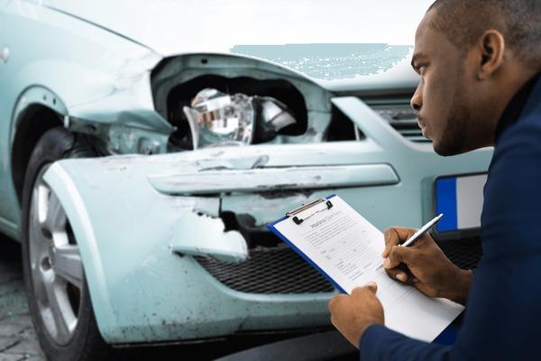 https://www.shutterstock.com/image-photo/african-american-car-insurance-agent-inspecting-600nw-1915759228.jpg
